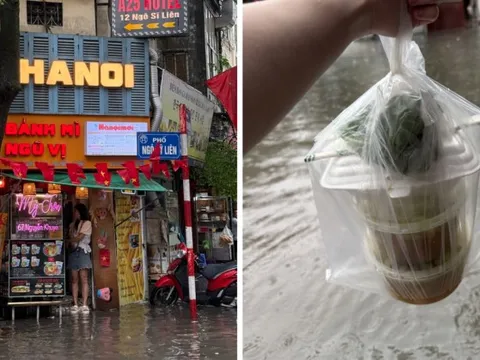 Loạt hàng quán ngập nước vẫn mở cửa, trở thành chỗ trú cho khách giữa thời tiết mưa lớn ở Hà Nội
