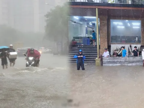 Mưa tầm tã không ngớt, "khu nhà giàu" Hà Nội ngập sâu: Nhiều biệt thự phải dựng rào chắn bằng tấm tôn, ngăn nước tràn vào
